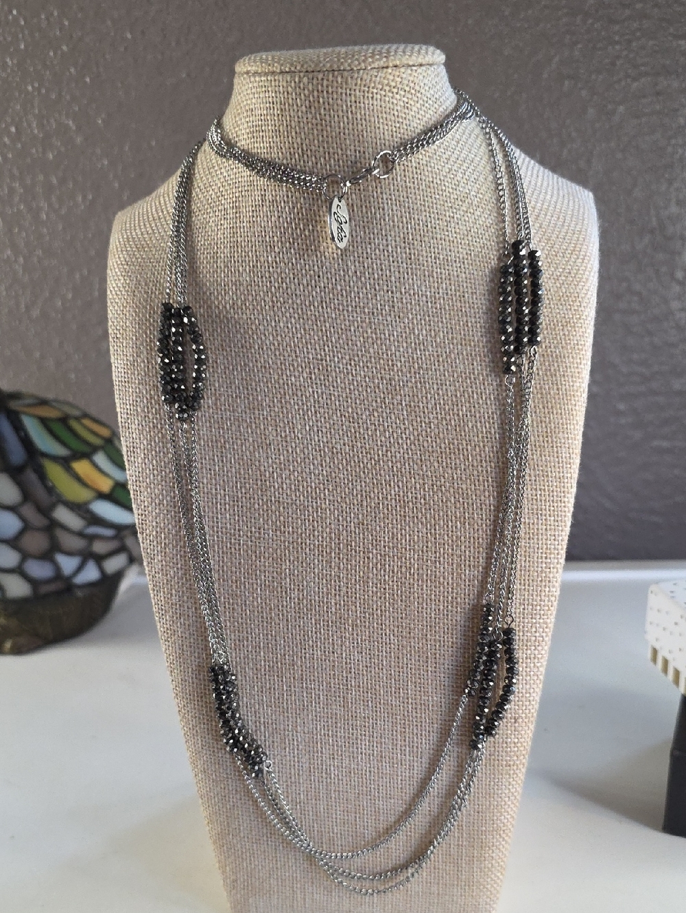 Multi-Layered Silver-Tone Necklace with Black Faceted Bead Accents